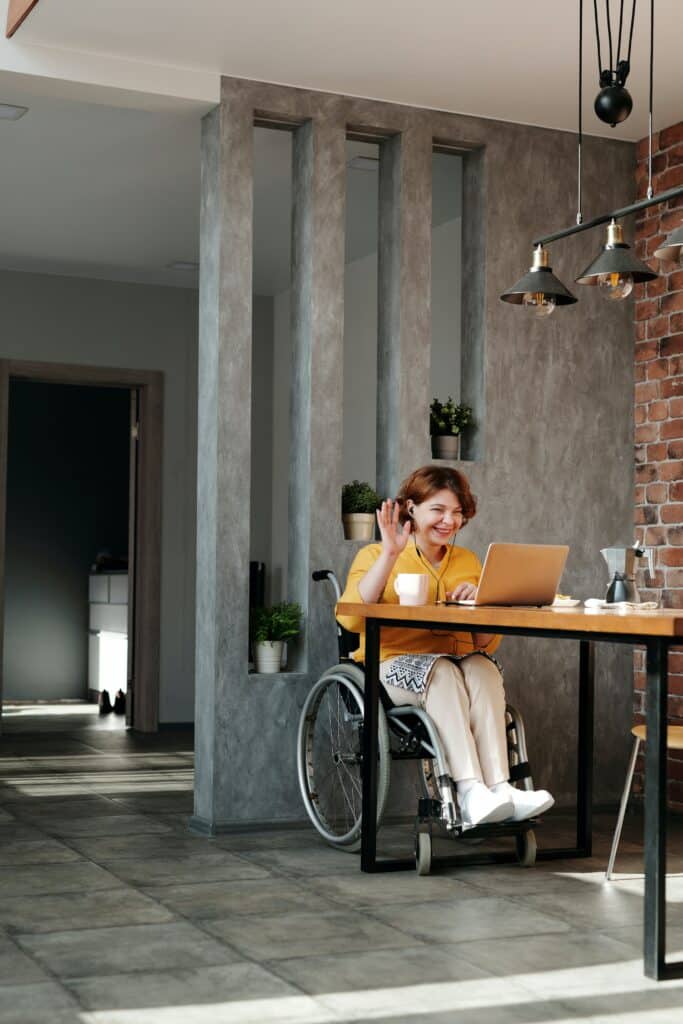 woman in wheelchair on computer